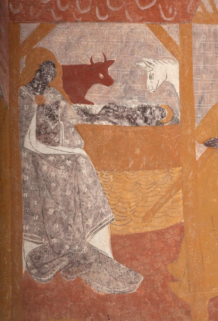 La Nativité, scène peinte sur le mur est et sur le registre inférieur de la retombée sud de la voûte.