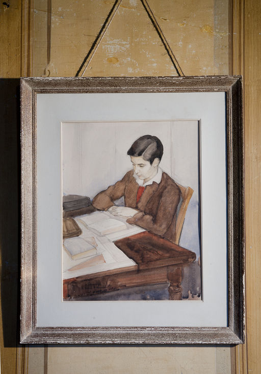 Salle à manger : Jean Mauriac lisant à une table, par Jean Aufort (1898-1988), aquarelle sur papier. 