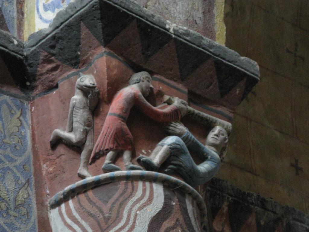 Travée sous clocher, pilier sud-est, face ouest, chapiteau : la dispute et diable à cloche-pied.